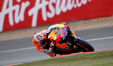 Stoner takes MotoGP title lead with win Stoner takes MotoGP title lead with win