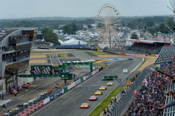 Jason Bright's 8Star entry leads a host of GT cars down the front straight at Le Mans, 2013