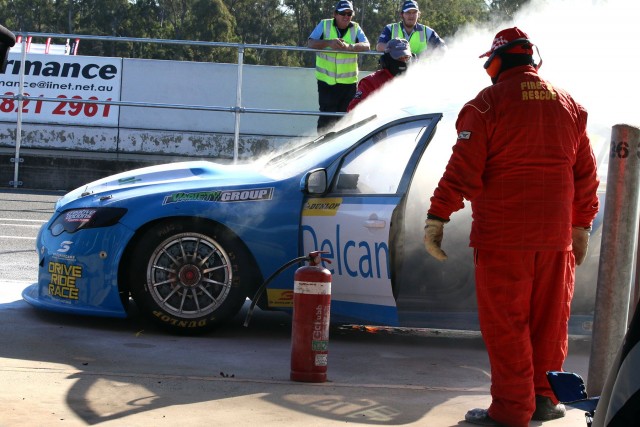 Morris' burning Ford in the Ipswich pitlane