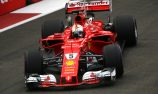 Vettel denies Verstappen pole in Singapore