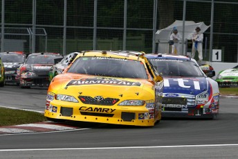 thumb Marcos Ambrose leads Carl Edwards in Montreal last year