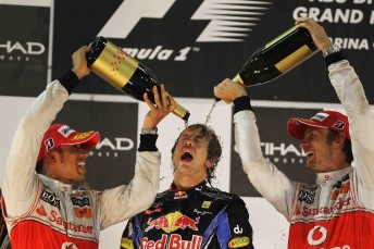 thumb Sebastien Vettel celebrates his 2010 championship victory with 2009 champion Jenson Button (right) and 2008 champion Lewis Hamilton (left)