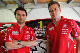 thumb Darren Turner and James Courtney with the window, paying tribute to the late Dan Wheldon
