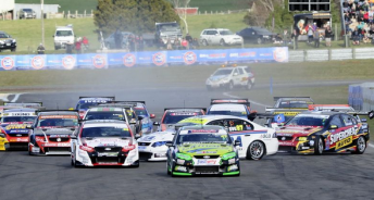 Scott McLaughlin (Supercheap Holden) and Shane van Gisbergen sideways on the straight at Taupo. Pic: V8 SuperTourers