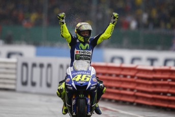 Valentino Rossi celebrates victory in British Grand Prix which saw him regain the lead of the championship.