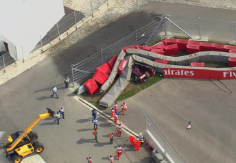 Carlos Sainz was buried underneath the Turn 13 barriers